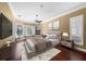 Main bedroom with hardwood floors and window seating at 4995 Quill Ct, Palm Harbor, FL 34685