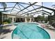 Spacious pool and spa with screened enclosure, perfect for entertaining at 4995 Quill Ct, Palm Harbor, FL 34685