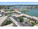 Stunning aerial view showcasing the community's swimming pool, parking, and surrounding waterways at 6201 2Nd E St # 73, St Pete Beach, FL 33706