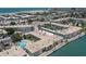 Beautiful aerial view of condo community featuring a sparkling swimming pool near ocean at 6201 2Nd E St # 73, St Pete Beach, FL 33706