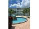 Community water fountain with lounge chairs, tables, and manicured landscaping at 6201 2Nd E St # 73, St Pete Beach, FL 33706