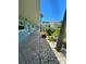 Exterior walkway lined with plants and stone, leading to units in the building at 6201 2Nd E St # 73, St Pete Beach, FL 33706