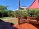 Deck with shade sail and view of backyard at 1705 Fox Run Dr, Tarpon Springs, FL 34689