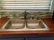 Modern kitchen sink with double basin and wood countertop at 1705 Fox Run Dr, Tarpon Springs, FL 34689