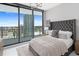 Modern bedroom with city views and a plush bed at 100 1St N Ave # 2205, St Petersburg, FL 33701