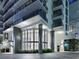 Modern building exterior at night, showcasing entrance at 100 1St N Ave # 2205, St Petersburg, FL 33701