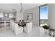 Modern dining room with a stunning live-edge table and water views at 100 1St N Ave # 2205, St Petersburg, FL 33701