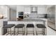 Modern kitchen with large island and bar stools at 100 1St N Ave # 2205, St Petersburg, FL 33701