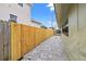 Small backyard with a paved patio and wooden fence at 800 Pasadena S Ave, St Petersburg, FL 33707