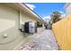 Private backyard with AC unit and paved pathway at 800 Pasadena S Ave, St Petersburg, FL 33707