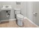 Clean bathroom featuring a toilet and sink at 800 Pasadena S Ave, St Petersburg, FL 33707