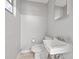 Small bathroom with toilet and sink at 800 Pasadena S Ave, St Petersburg, FL 33707