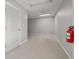 Empty office space with grey walls and carpet at 800 Pasadena S Ave, St Petersburg, FL 33707