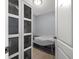 Room with a cabinet and a massage table at 800 Pasadena S Ave, St Petersburg, FL 33707