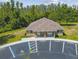 Aerial view showcases the building and surrounding parking area at 13856 Royston Bnd, Hudson, FL 34669