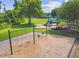 Playground area featuring modern play structures, swings, and ample room for activities at 13856 Royston Bnd, Hudson, FL 34669