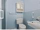 Small bathroom with light blue tile and a pedestal sink at 4031 Reggie Dr, Holiday, FL 34691