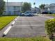 Well maintained parking lot with ample parking spaces and green spaces at 217 Orion Ln # 59, Treasure Island, FL 33706