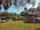 Community playground with a colorful play structure and picnic area at 217 Orion Ln # 59, Treasure Island, FL 33706