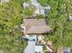 Aerial view showcasing home, lush landscaping, and backyard patio at 131 Pennsylvania Ave, Palm Harbor, FL 34683