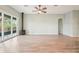 Spacious living room featuring wood-look tile floors and a fireplace at 131 Pennsylvania Ave, Palm Harbor, FL 34683