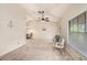 Inviting living room with vaulted ceilings, a ceiling fan, and neutral tones creating a serene atmosphere at 3482 Rolling Trl, Palm Harbor, FL 34684