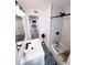 Updated bathroom with marble shower, patterned floor, and a white vanity at 811 40Th S Ave, St Petersburg, FL 33705