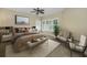 Main bedroom with neutral decor, large window, and ceiling fan at 1733 Split Fork Dr, Oldsmar, FL 34677