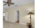 Spacious bedroom with ceiling fan and neutral walls at 1733 Split Fork Dr, Oldsmar, FL 34677