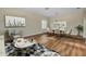 Dining room with light wood floors and a marble-top table at 1733 Split Fork Dr, Oldsmar, FL 34677