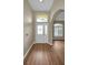 Inviting entryway with hardwood floors and arched doorways at 1733 Split Fork Dr, Oldsmar, FL 34677