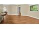 Hardwood floors and neutral walls in a bright hallway at 1733 Split Fork Dr, Oldsmar, FL 34677