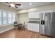 Kitchen boasts stainless steel appliances and white cabinetry at 1733 Split Fork Dr, Oldsmar, FL 34677