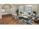 Living room with light beige couch and geometric patterned rug at 1733 Split Fork Dr, Oldsmar, FL 34677