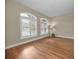 Spacious living room featuring hardwood floors and plantation shutters at 1733 Split Fork Dr, Oldsmar, FL 34677