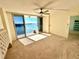 Bright bedroom with water views and sliding glass doors to balcony at 100 Pierce St # 703, Clearwater, FL 33756