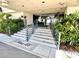 Welcoming building entrance with stairs and landscaping at 100 Pierce St # 703, Clearwater, FL 33756