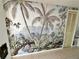 Hallway with tropical-themed mural and tiled floor at 100 Pierce St # 703, Clearwater, FL 33756
