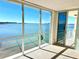 Spacious living room with stunning water views and large windows at 100 Pierce St # 703, Clearwater, FL 33756