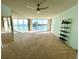 Living room boasts water views, ceiling fan, and modern shelving at 100 Pierce St # 703, Clearwater, FL 33756