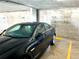 Indoor parking garage with a black Jaguar at 100 Pierce St # 703, Clearwater, FL 33756