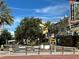 View of a city street with palm trees and Capitol Theatre at 100 Pierce St # 703, Clearwater, FL 33756