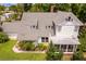 White two-story house with gray roof, screened porch, and balcony at 716 14Th Ne Ave, St Petersburg, FL 33701