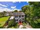 White house with gray roof, landscaping, and brick walkway at 716 14Th Ne Ave, St Petersburg, FL 33701