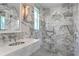 Spa-like bathroom with a walk-in shower and marble tile at 716 14Th Ne Ave, St Petersburg, FL 33701