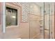 Updated bathroom featuring pink tile and a glass-enclosed shower at 716 14Th Ne Ave, St Petersburg, FL 33701