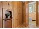 Retro bathroom with pink tile and wood flooring at 716 14Th Ne Ave, St Petersburg, FL 33701