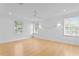 Large bedroom with hardwood floors and multiple windows at 716 14Th Ne Ave, St Petersburg, FL 33701
