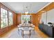 Modern dining room featuring wood paneling and a stylish light fixture at 716 14Th Ne Ave, St Petersburg, FL 33701