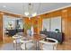 Dining room with a wood table, modern chairs, and kitchen view at 716 14Th Ne Ave, St Petersburg, FL 33701